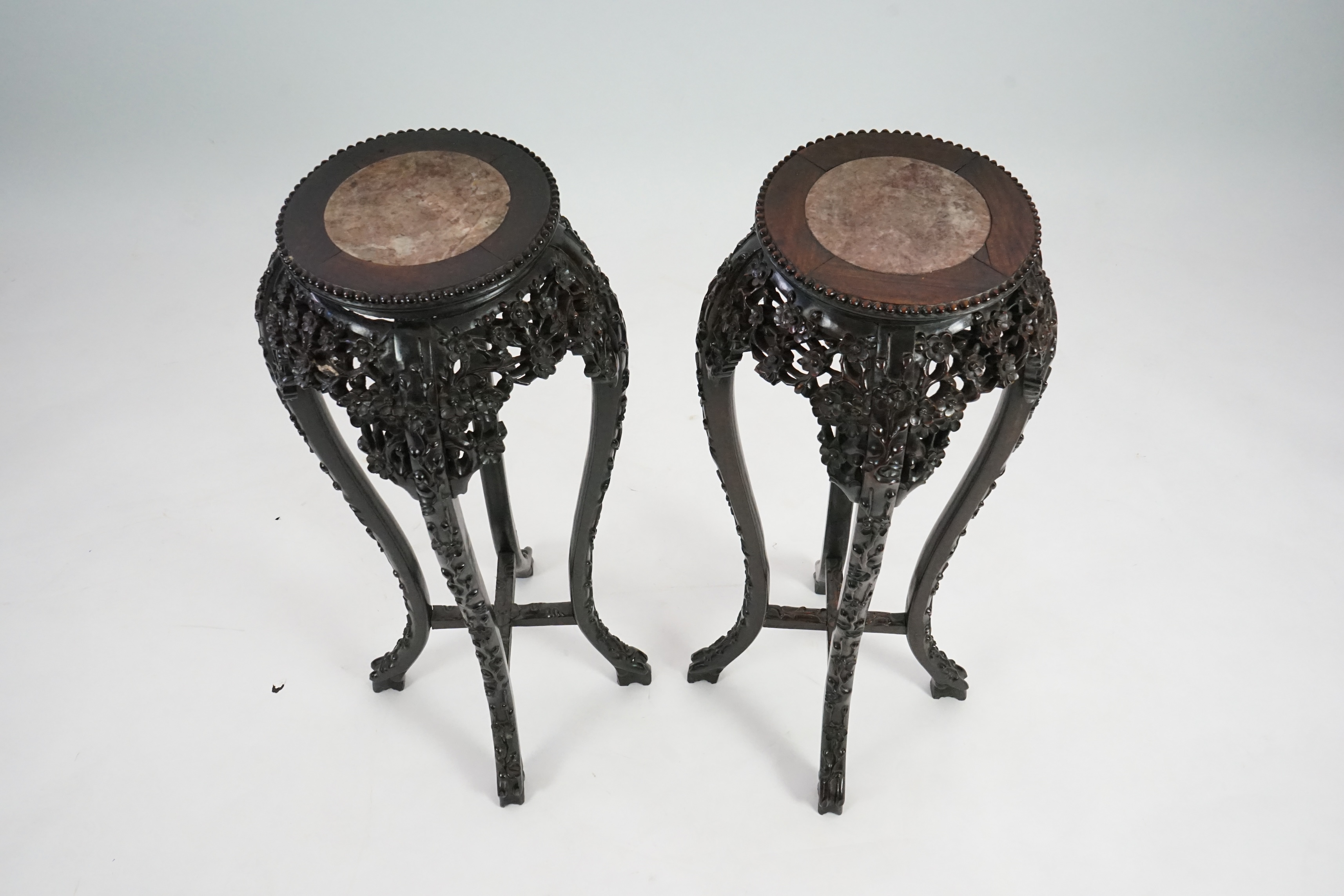 A pair of late 19th century Chinese hongmu and marble inset vase stands, height 91cm. Condition - fair to good